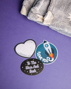 Photo of 3 stickers included with Deluxe To The Moon & Back Bundle