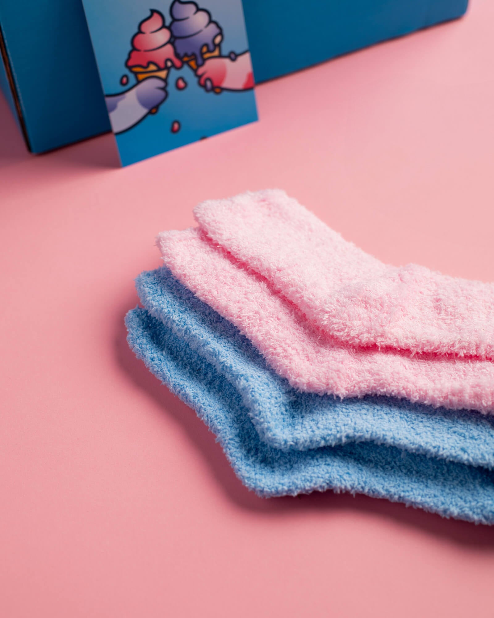 Photo of pink and blue fuzzy socks.