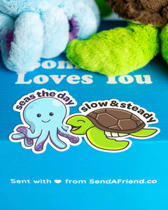 Photo of Tucker the Turtle and Ollie the Octopus sitting on Someone Loves you box.