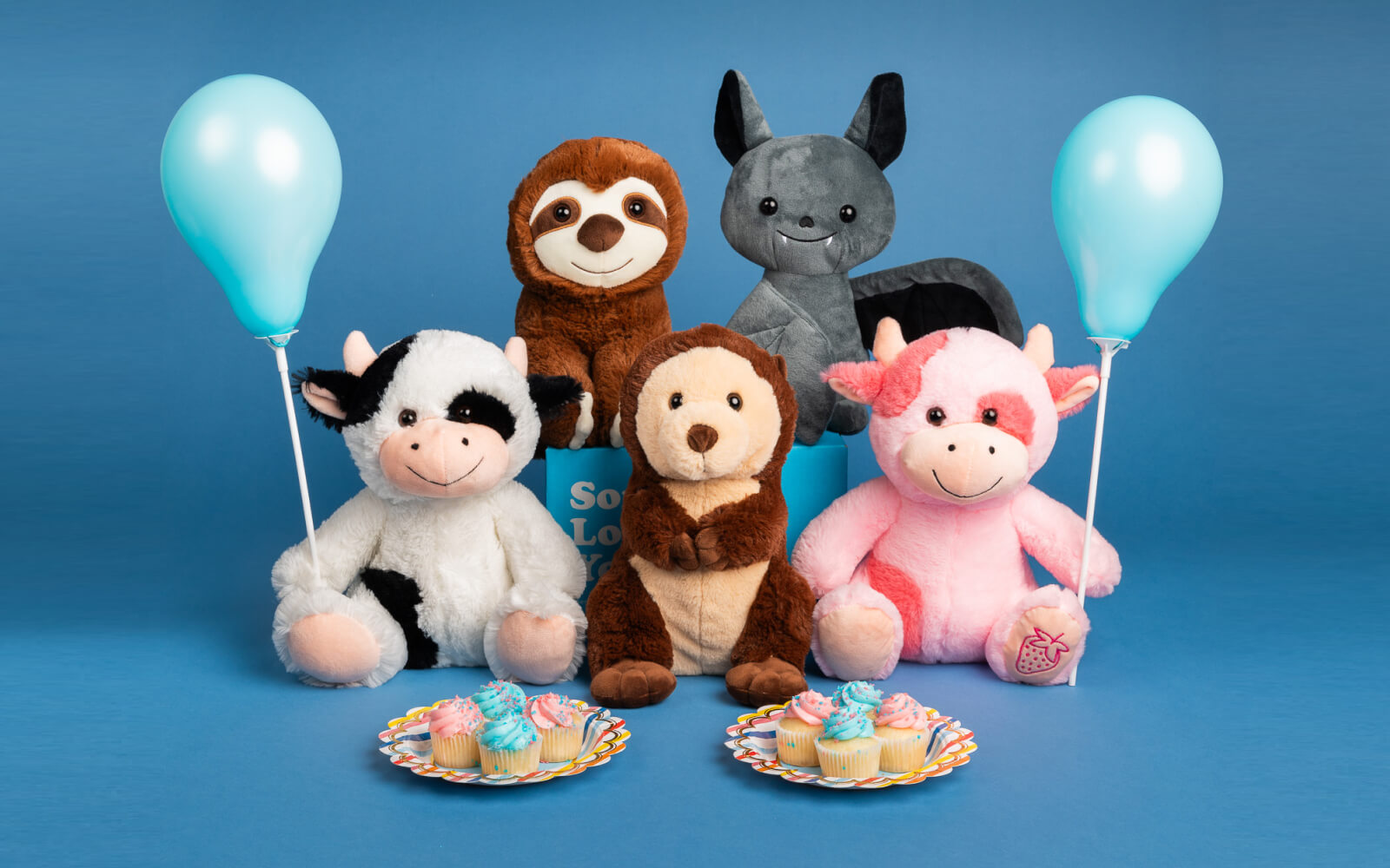 five stuffed animals holding balloons with cupcakes on plates