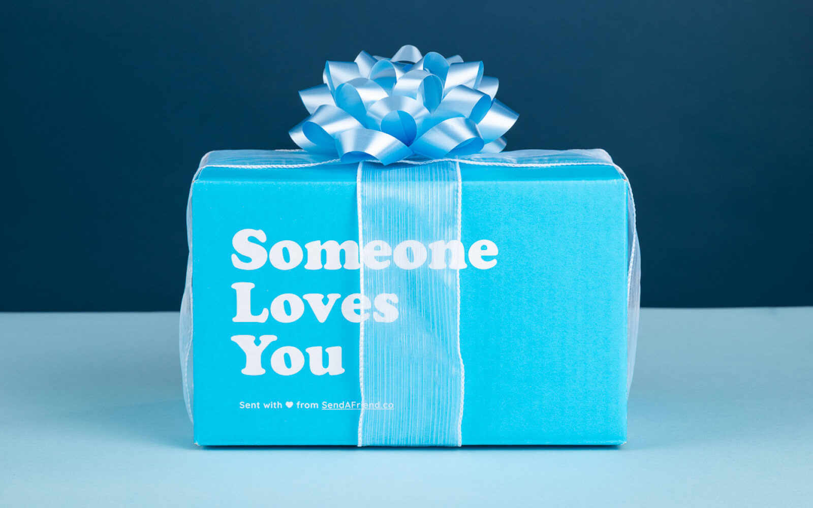 blue "someone loves you" box with ribbon and a bow