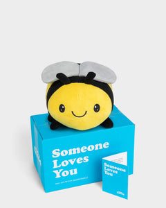 Photo of yellow and black Beatrice the Bee plushie with Someone Loves You box and notecard