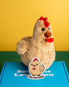 Photo of Rowdy the Rooster plushie with matching sticker on Someone Loves You box.