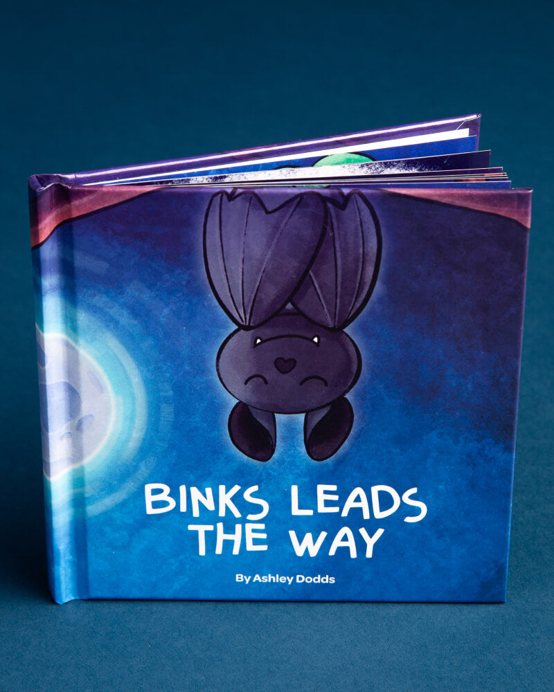 Photo of Binks Leads the Way storybook on a blue background