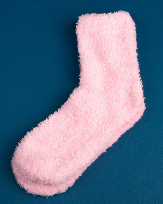 Photo of pink fuzzy socks on a blue background
