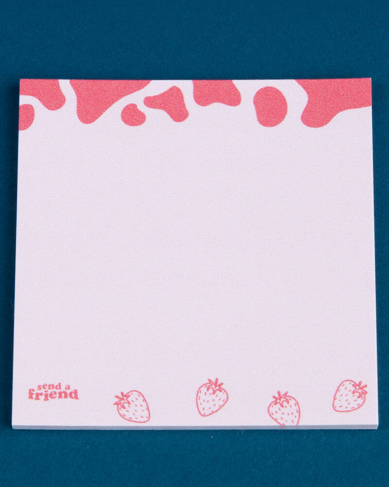 Photo of strawberry-themed sticky notes on a blue background