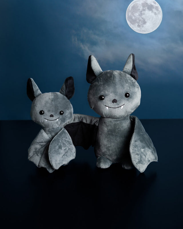Photo of 10 inch and 14 inch black Binks the Bat plushies with sky and moon in background 