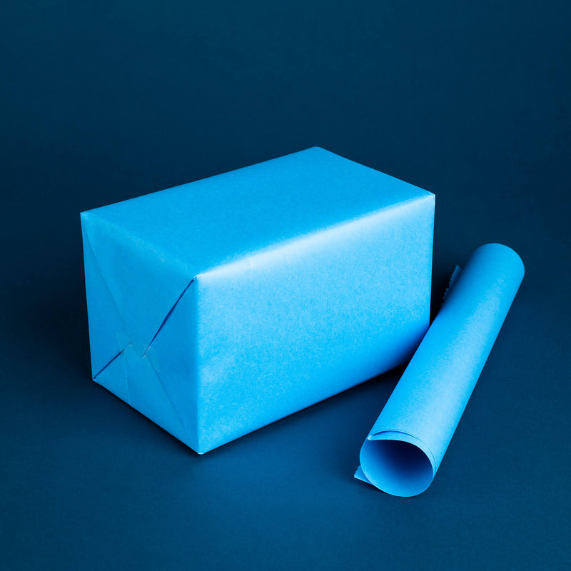 Photo of box wrapped in blue protective wrapping paper